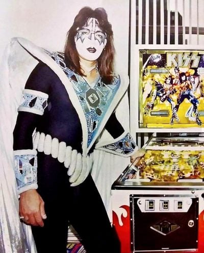 Ace Frehley with the Kiss pinball machine, 1980