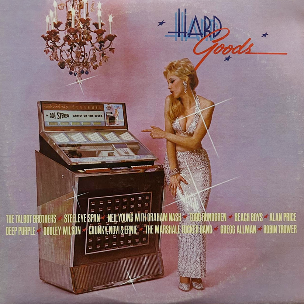 On 29. May, 1974, Kiss made their first compilation album appearance, with the song “Strutter” featured on Warner Bros.’ double LP “Hard Goods”. Front.